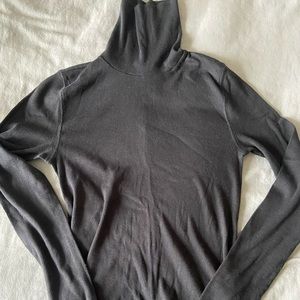 Black ribbed turtle neck. Good condition